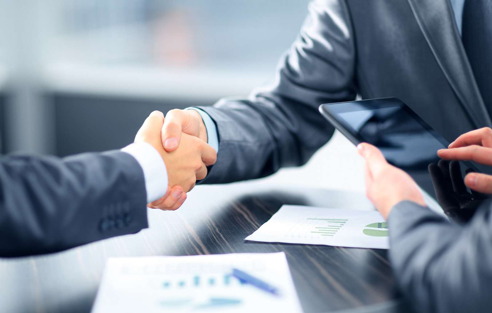 Compliance: business partners shaking hands
