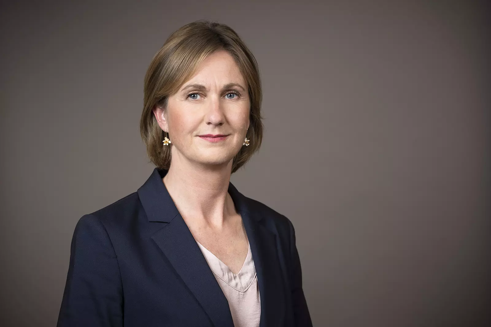 Andrea Bertallot in front of a green-grey background