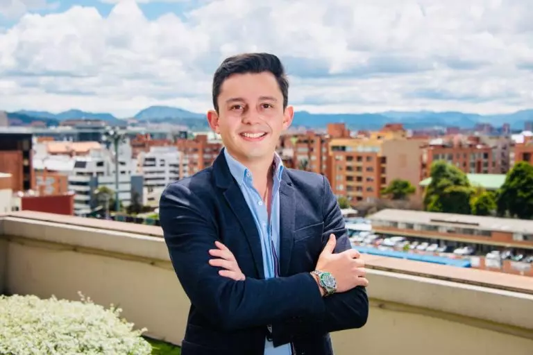 Luis Felipe Urrego on a balcony